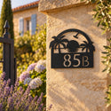 Numéro de maison personnalisé – design Coucher de soleil sur un pilier de portail en pierre · Steelmonks